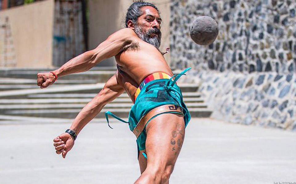 photo of man using hips to hit game ball